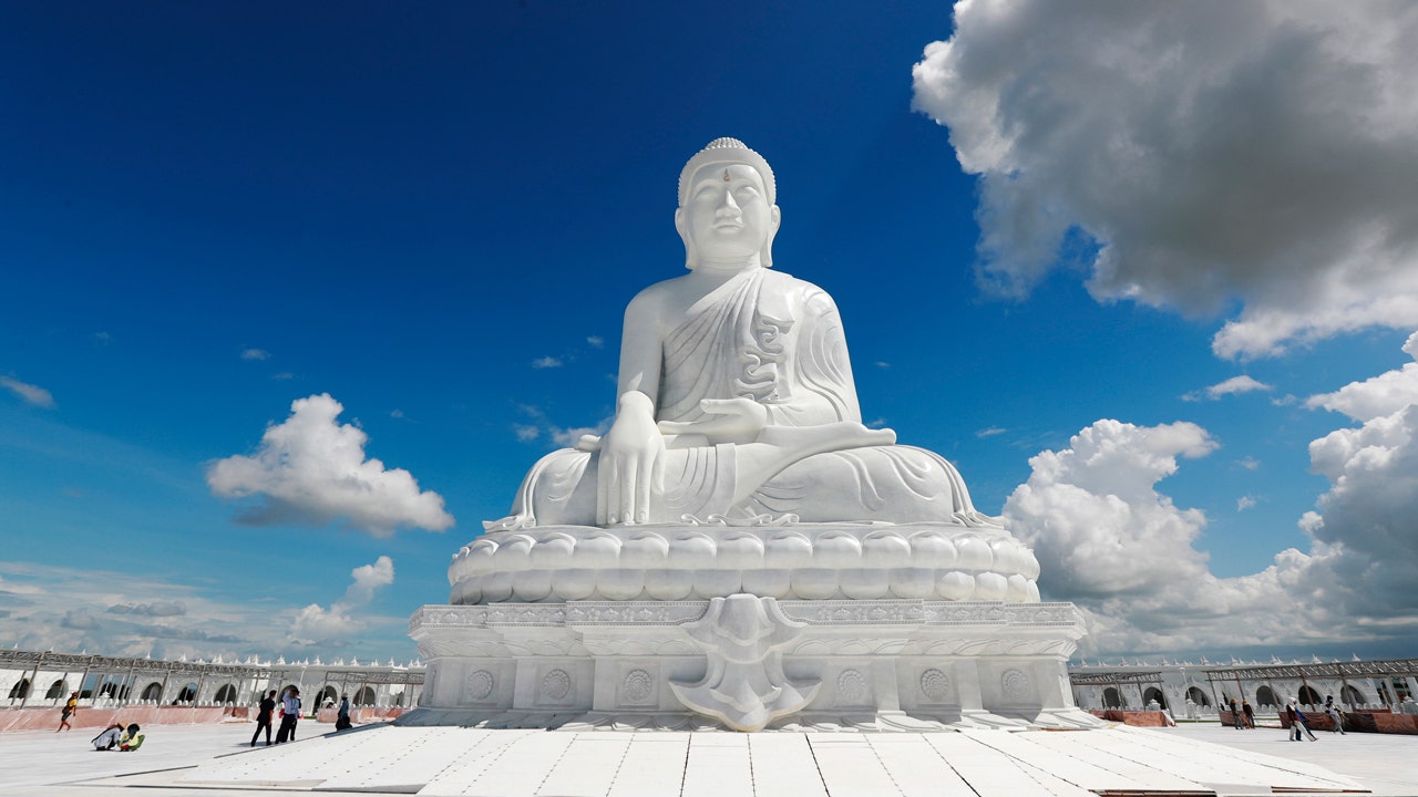 Burma's military government unveils giant sitting Buddha statue amid ongoing civil war and turmoil